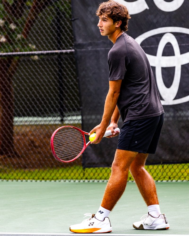 Aidan Peskin preparing to serve